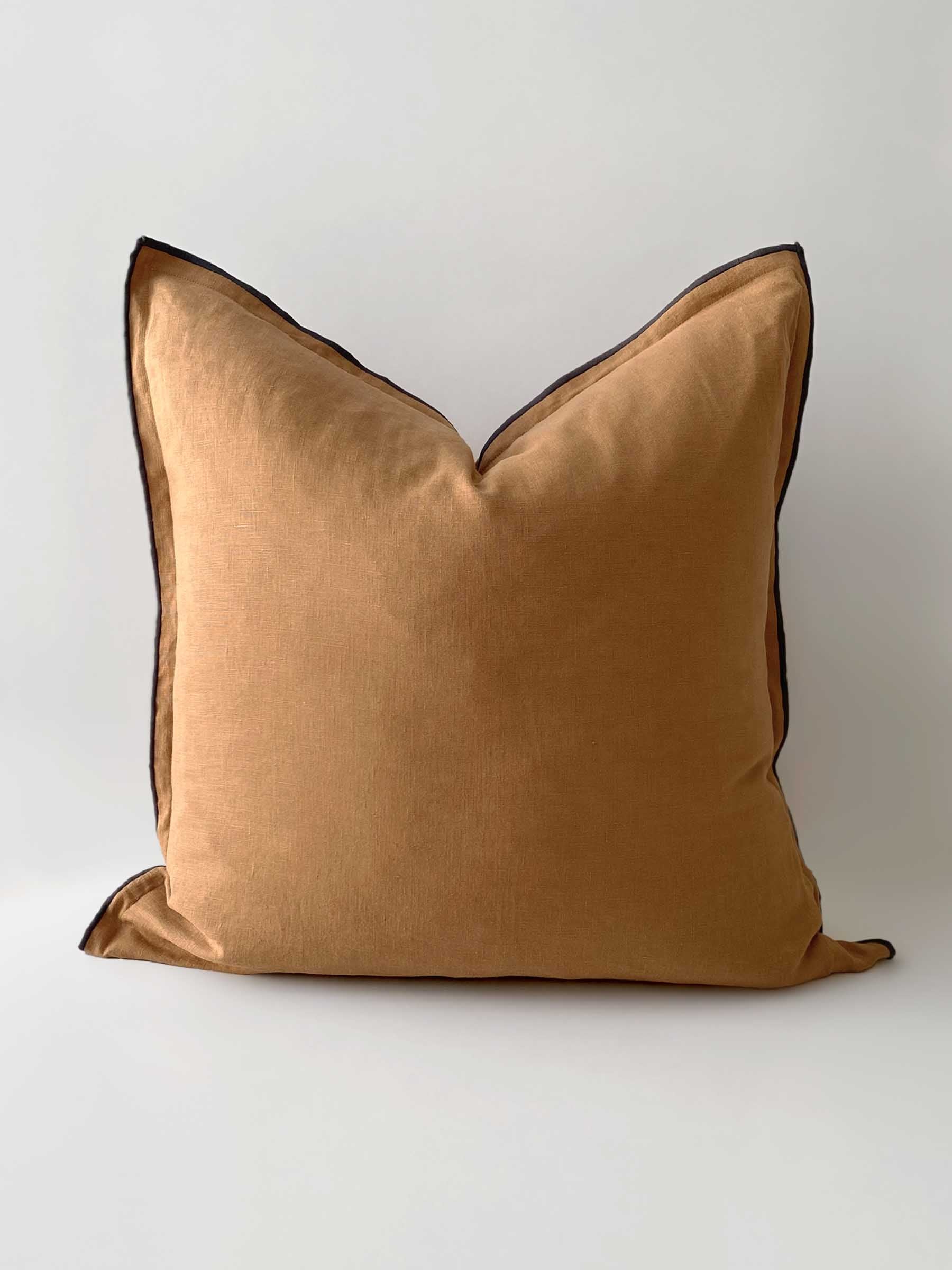 Harlow cushion in Butterscotch colour 50cm square with overstitching trim in contrasting colour graphite made from French Flax linen