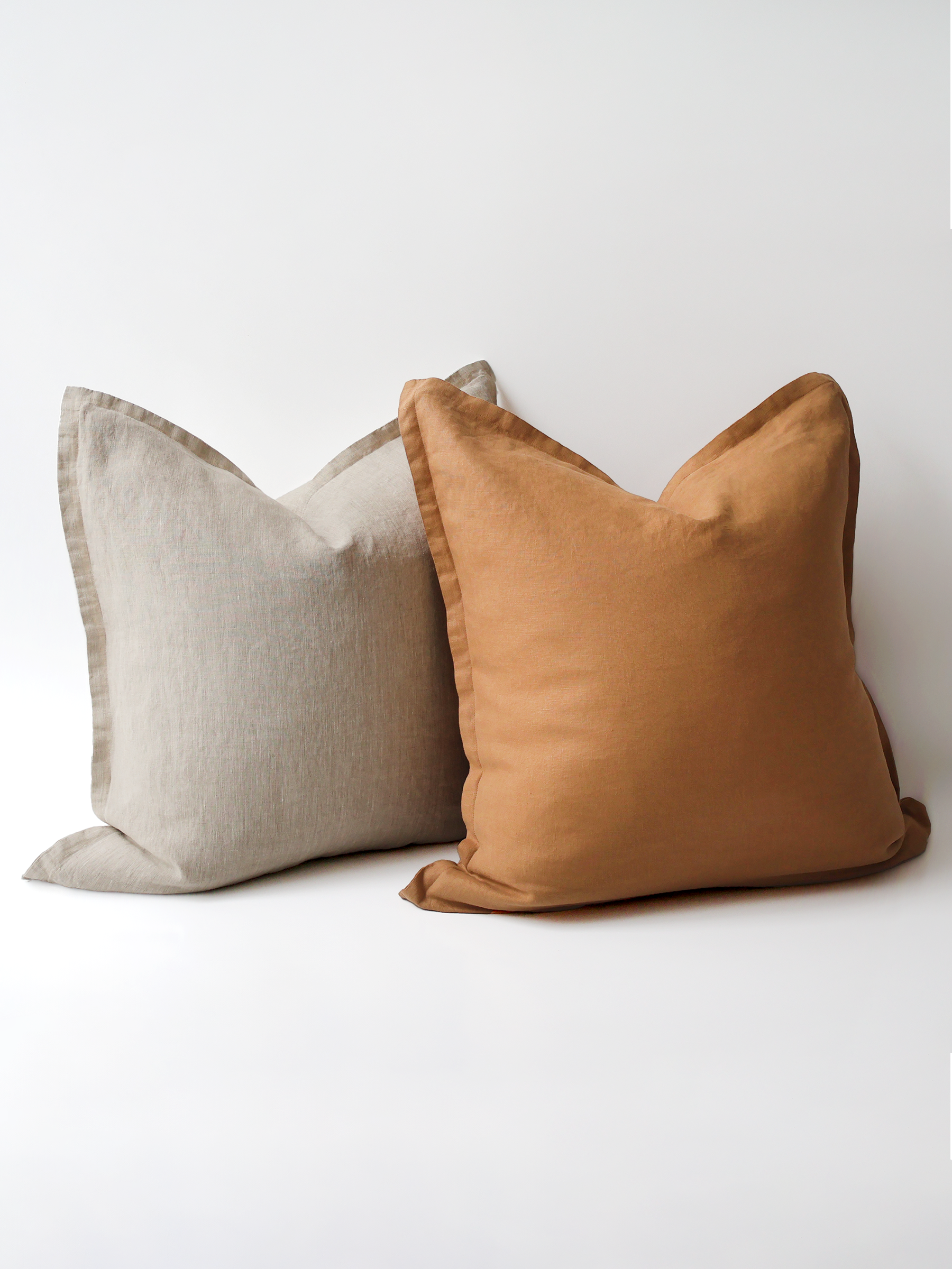 A video demonstration showing the Reversi® reversible linen flange square cushion design in natural and butterscotch and how it flips inside out for a whole new look