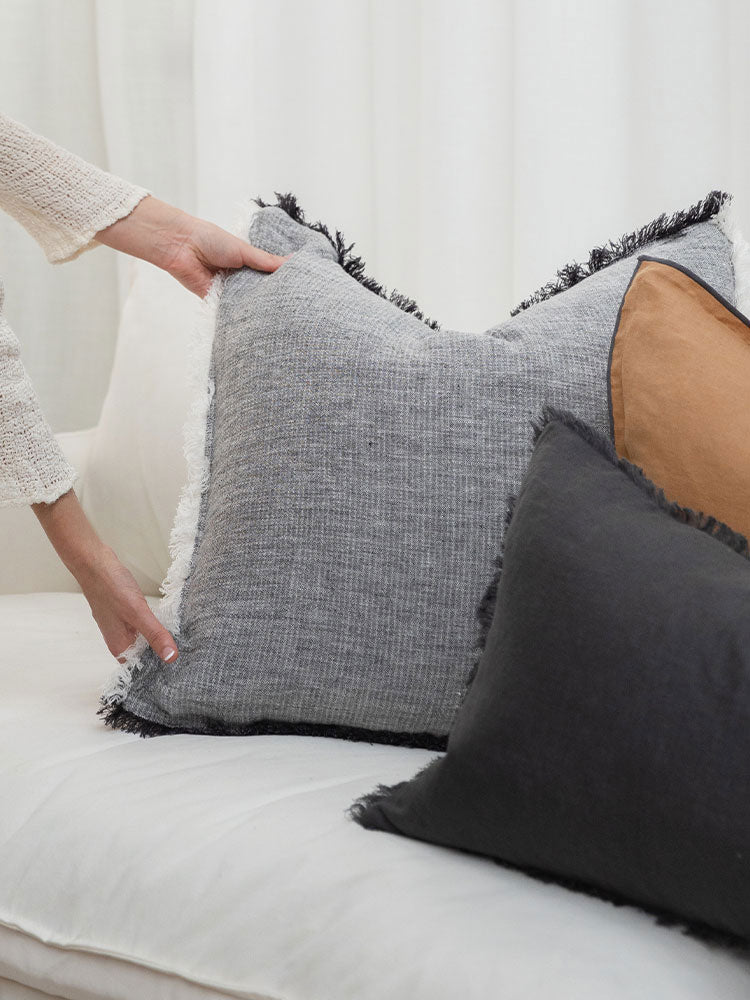 Linen cushions styled on sofa, Mayco House our difference premium French flax linen.